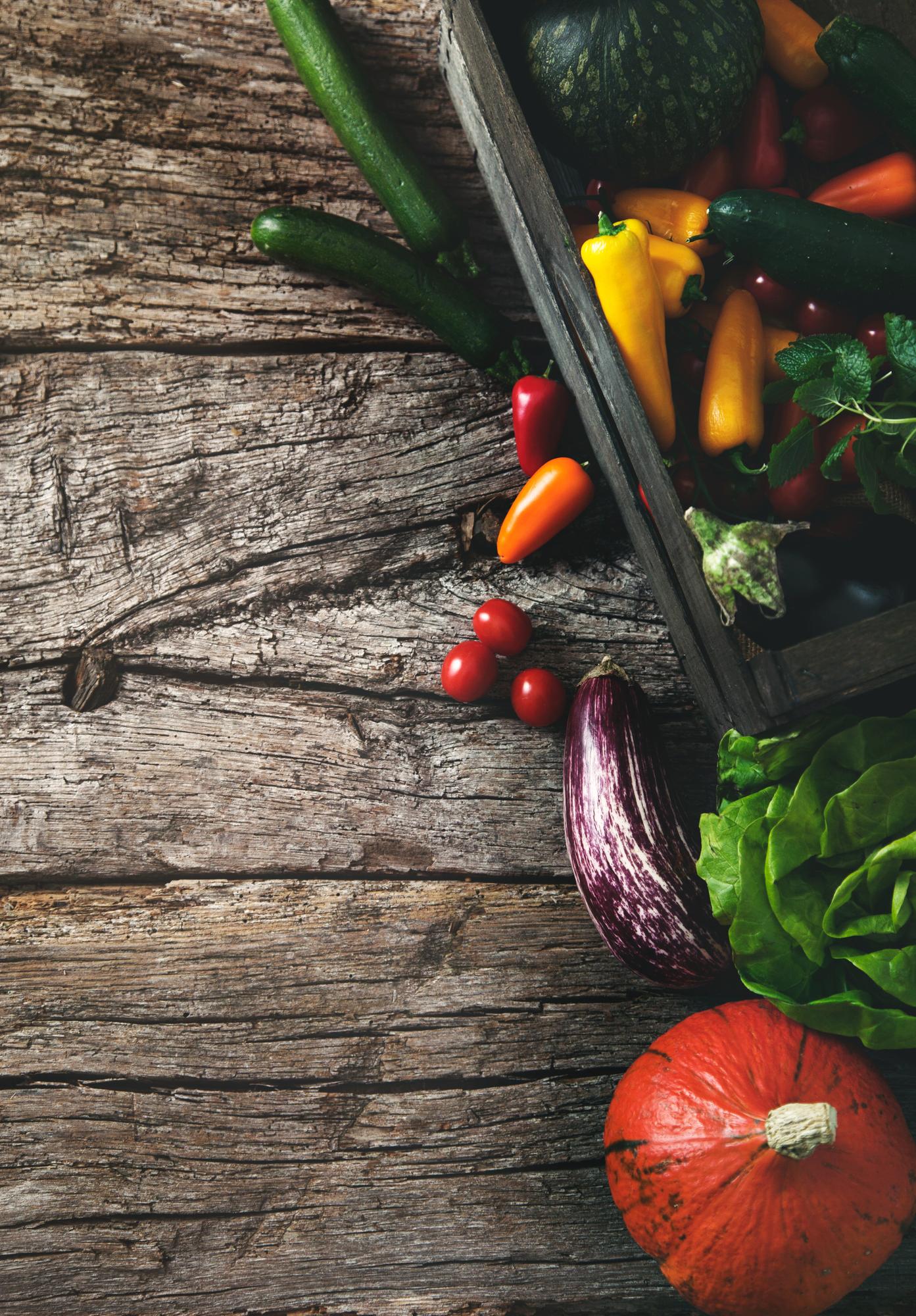Close-up of fresh seasonal vegetables on a wooden table
